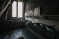 Burnt house interior. Charred walls of toilet after a fire Royalty Free Stock Photo