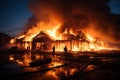 burnt houses engulfed in fire and smoke at night