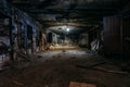 Burnt interior of industrial building basement. Walls in black soot after fire