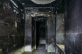 Burnt mansion interior after fire. Walls in black soot