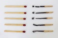 Burnt matchsticks and new matchsticks on white background. Different stages of matchsticks. Royalty Free Stock Photo