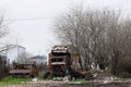 Burnt old cars stand on the street