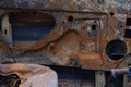 Burnt old rusty car parts. Looting, arson and terrorism. Royalty Free Stock Photo