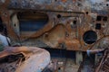 Burnt old rusty car parts. Looting, arson and terrorism. Royalty Free Stock Photo
