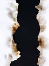 Burnt old torn white paper on black background Royalty Free Stock Photo