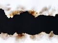 Burnt old torn white paper on black background Royalty Free Stock Photo