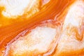 Burnt orange liquid and white foam mixing raster background. Colorful fluid splashes realistic illustration. Golden oil Royalty Free Stock Photo