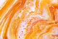 Burnt orange liquid and white foam mixing raster background. Colorful fluid splashes realistic illustration. Golden oil Royalty Free Stock Photo