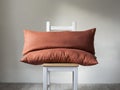 Burnt orange lumbar pillows set of 2. Long pillows on wood chair