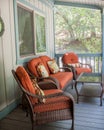 Burnt orange patio furniture outside on the deck Royalty Free Stock Photo