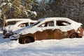 Burnt-out cars covered in snow Royalty Free Stock Photo