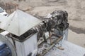 Burnt-out insulation of the ventilation duct from the barbecue and the induction motor on the roof of the building Royalty Free Stock Photo