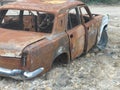 burnt out limousine, abandoned and rusty wrecked vehicle