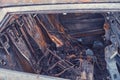 Burnt-out rusty cars on a city street, vandalism. Setting fire to cars by vandals and damage to property Royalty Free Stock Photo