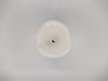 burnt out white candle. one burnt white candle on a white background top view Royalty Free Stock Photo