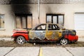Burnt red car after fire accident