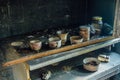 Burnt room interior. Burnt still life. Charred wall, cups in black soot