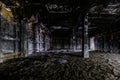 Burnt and ruined interior of industrial building after fire. Consequences of war, fire or other disaster Royalty Free Stock Photo