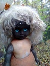 Burnt scary baby doll with blue eyes Royalty Free Stock Photo