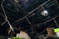 Burnt suspended ceiling and charred metal floor covering after a fire Royalty Free Stock Photo