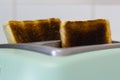 Burnt toast jumping out of the toaster Royalty Free Stock Photo