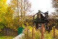 Burnt traditional Russian wooden house izba in autumn Royalty Free Stock Photo