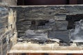 burnt wood from original doors and windows. Ancient city in Herculaneum archaeological park, Naples, Italy.