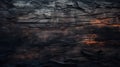 Burnt wood texture background, charred black timber close-up. Abstract pattern of dark burned scorched woodgrain. Concept of