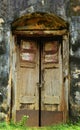 Burnt wooden door. A burnt wooden round door of old castle