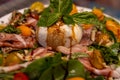 Burrata on top of a salad Royalty Free Stock Photo