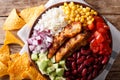 Burrito bowl with chicken grilled, rice and vegetables close-up. horizontal top view, Mexican style Royalty Free Stock Photo