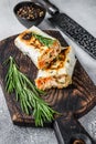 Burrito with grilled chicken and vegetables, fajitas, shawarma. White Wooden background. Top view