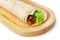 Burrito with pork meat and vegetables at wood desk Royalty Free Stock Photo