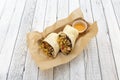 Burrito stuffed with grilled chicken, black beans and rice with cheese sauce