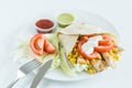 Burrito wrap with tomato, corn, lettuce, chicken, mayonnaise and sauces with white background Royalty Free Stock Photo