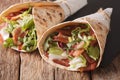 Burritos with bacon and fresh mix of salad close-up. horizontal Royalty Free Stock Photo