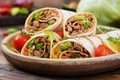 Burritos wraps with beef and vegetables on a wooden background. Royalty Free Stock Photo