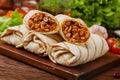 Burritos wraps with meat, beans and vegetables Royalty Free Stock Photo