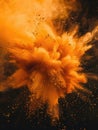 A burst of orange powder fills the air Royalty Free Stock Photo