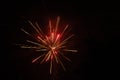 Burst of red fireworks at night - vibrant red streaks and sparks - smoke clouds - celebration, new years day, fourth of july, Royalty Free Stock Photo