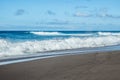 Bursting blue sea wave and black and volcanic sand at Santa BÃÂ¡rbara beach, SÃÂ£o Miguel - Azores PORTUGAL Royalty Free Stock Photo