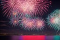 Bursting fireworks illuminate the night sky with a dazzling display of color and light, painting the darkness with Royalty Free Stock Photo