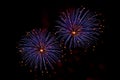 Bursts of Blue and Orange Fireworks