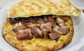 Buryan lamb slow-cooked in a pit served on a flat bread Royalty Free Stock Photo
