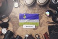 Buryatia Flag Between Traveler`s Accessories on Old Vintage Map. Overhead Shot