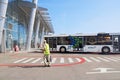 Bus, airport building and unidentified airport worker. Igor Sikorsky Kyiv International Airport Zhuliany