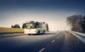 Bus on asphalt road in beautiful spring day Royalty Free Stock Photo