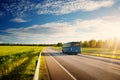 Bus on asphalt road in beautiful spring day Royalty Free Stock Photo