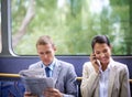 Bus, business people and commute for communication or news, reading newspaper and phone call for info. Woman, networking Royalty Free Stock Photo