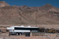 A bus carrying immigrants arrives at the US Border Patrol Station, El Paso Texas, temporary housing / processing area Royalty Free Stock Photo